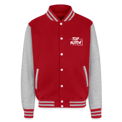 Step into style and comfort with the Just Hoods Heavyweight Letterman Jacket. This classic piece features a knitted collar, cuffs, and waistband adorned with stylish striped details that add a touch of sporty elegance. Secure your fit easily with press-stud closure buttons and enjoy modern convenience with a hidden earphone cord feed inside the pocket and discreet loops inside the collar. Perfect for the tech-savvy and fashion-forward individual, this jacket combines timeless design with functional features
