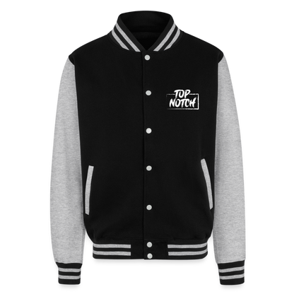 Step into style and comfort with the Just Hoods Heavyweight Letterman Jacket. This classic piece features a knitted collar, cuffs, and waistband adorned with stylish striped details that add a touch of sporty elegance. Secure your fit easily with press-stud closure buttons and enjoy modern convenience with a hidden earphone cord feed inside the pocket and discreet loops inside the collar. Perfect for the tech-savvy and fashion-forward individual, this jacket combines timeless design with functional features