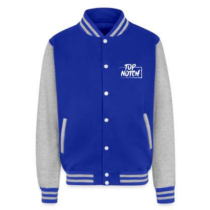 Step into style and comfort with the Just Hoods Heavyweight Letterman Jacket. This classic piece features a knitted collar, cuffs, and waistband adorned with stylish striped details that add a touch of sporty elegance. Secure your fit easily with press-stud closure buttons and enjoy modern convenience with a hidden earphone cord feed inside the pocket and discreet loops inside the collar. Perfect for the tech-savvy and fashion-forward individual, this jacket combines timeless design with functional features